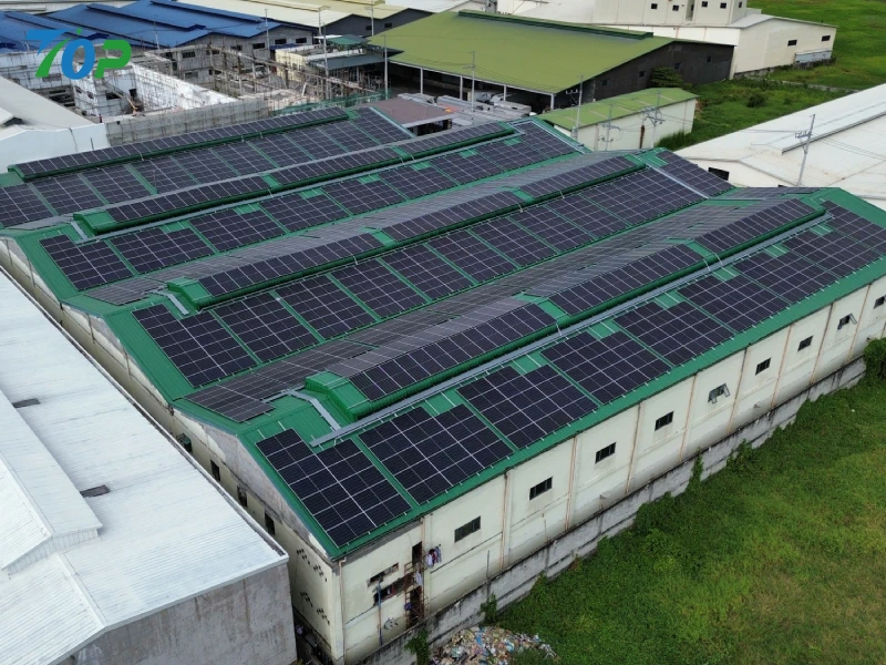 Commercial solar racking system installed on an industrial factory metal roof in Manila.